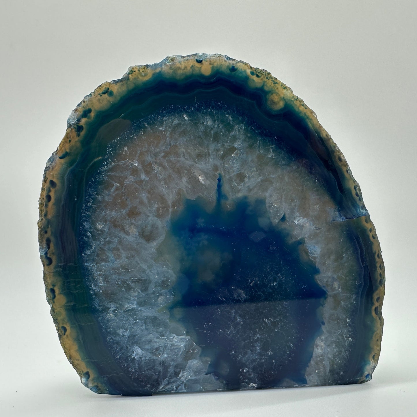 Polished blue agate end with crystalline centre — symbol of calm, balance, and gentle protection